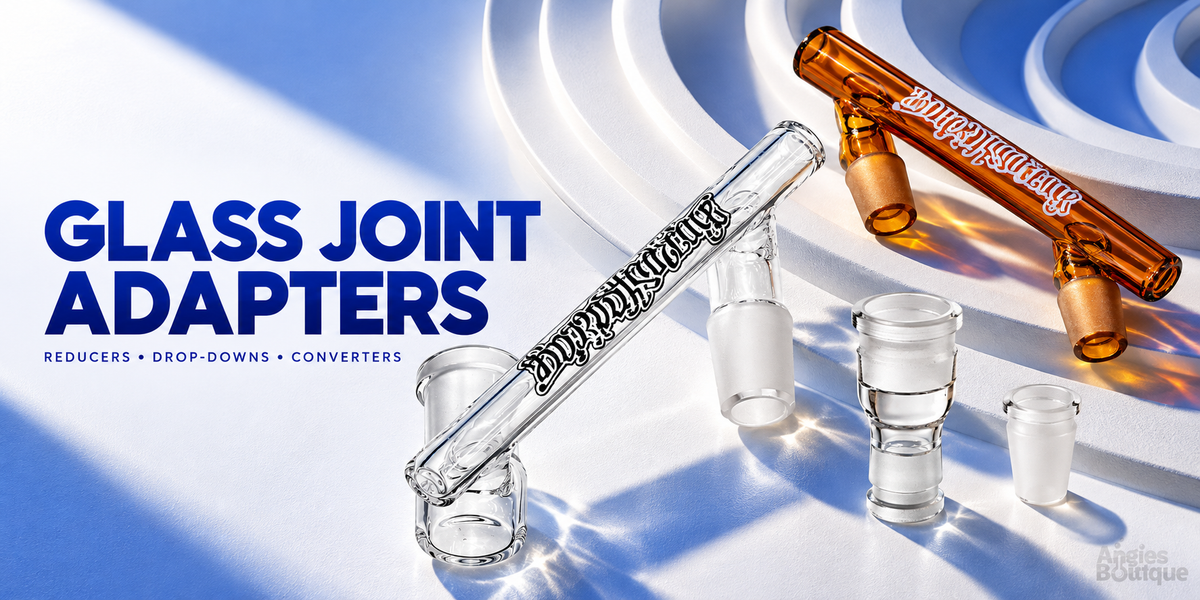 Glass joint adapters: clear and amber glass drop-downs with frosted-joint reducers and converters on a white and blue set