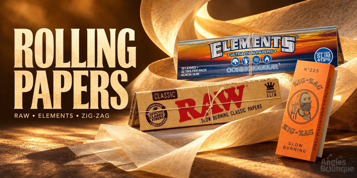 Rolling papers: RAW Classic, Elements and Zig-Zag paper packs on a warm gold background with loose rolling paper