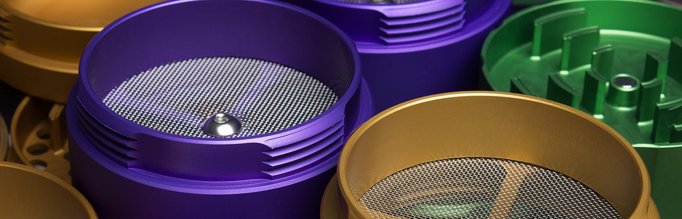 Premium 4-piece aluminum herb grinder with kief catcher and sharp diamond-shaped teeth on a white background