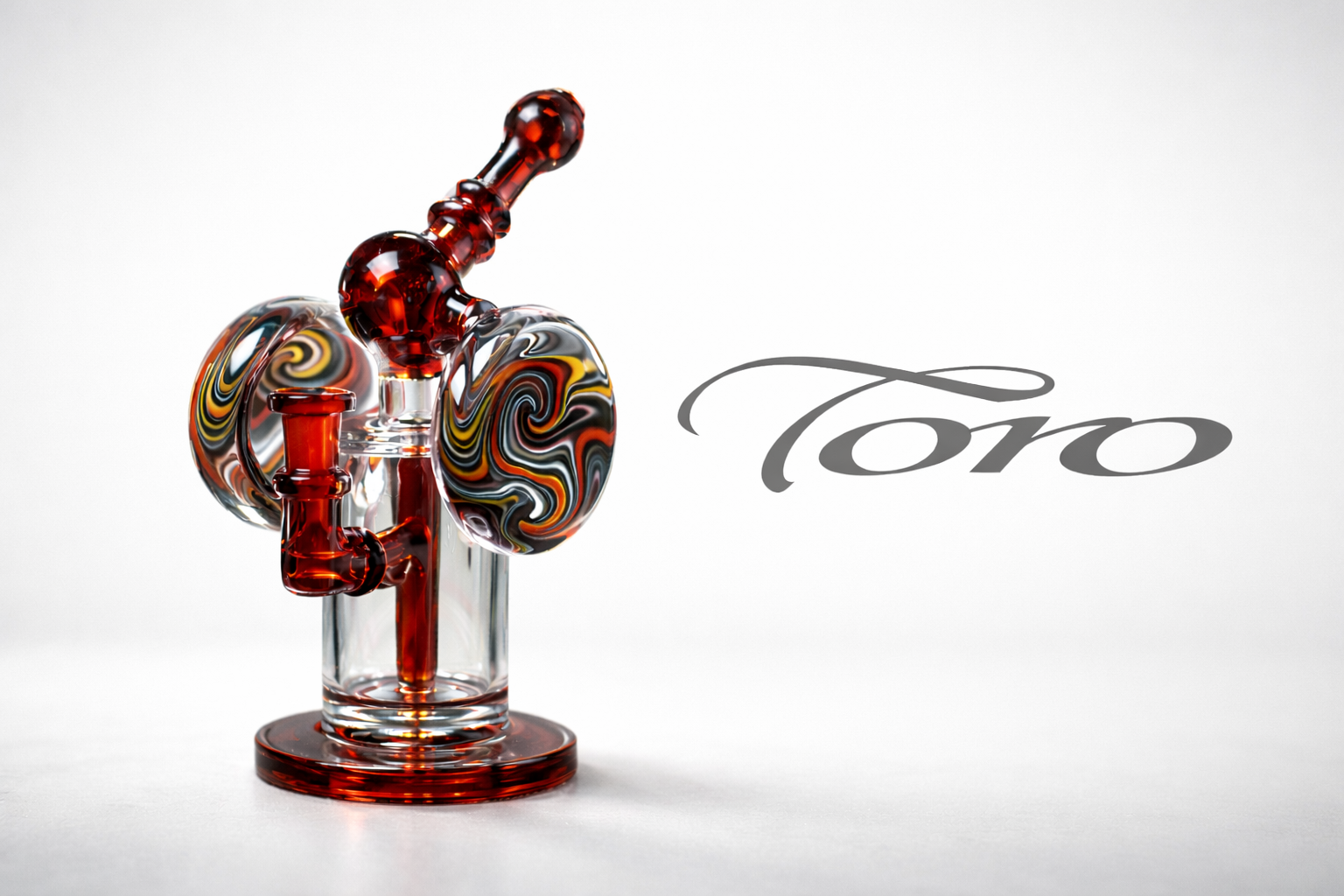 Toro Glass bong with signature wig-wag glasswork and precision percolator design on a clean studio background