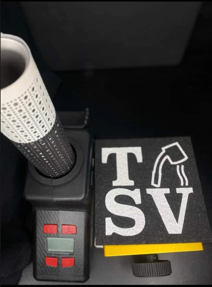 Top view of Terp Sous Vide torch and TSV mat on gold lift, highlighting digital controls and compact design for dabbing accuracy.