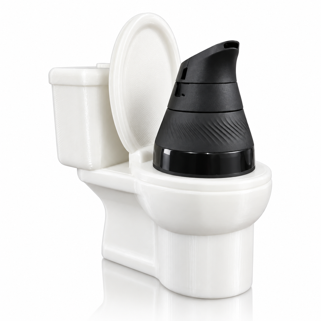 710 Print Shop 3D printed toilet attachment in white, lid up, with a black Puffco Proxy Core seated in the bowl