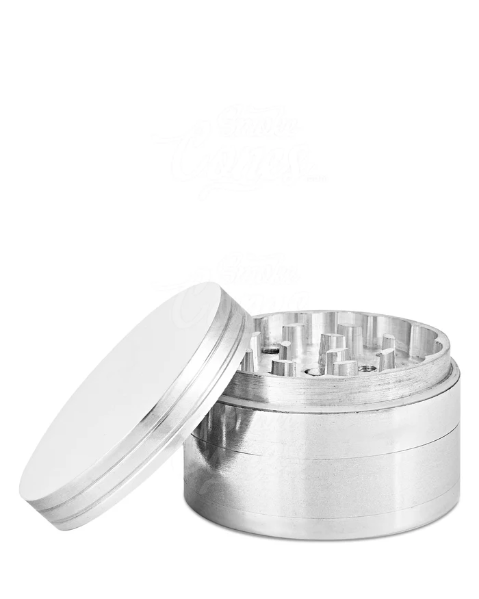 Upright grinder with lid off, exposing the grinding chamber and diamond-cut teeth