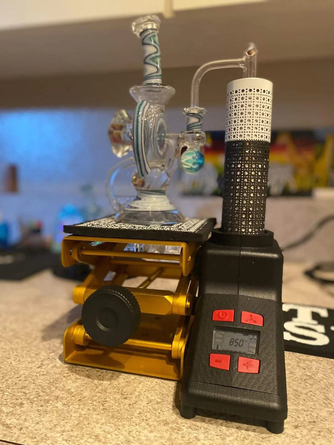 Terp Sous Vide Complete Kit in use with a glass dab rig on the gold lift, showing digital temperature display set to 850°F.