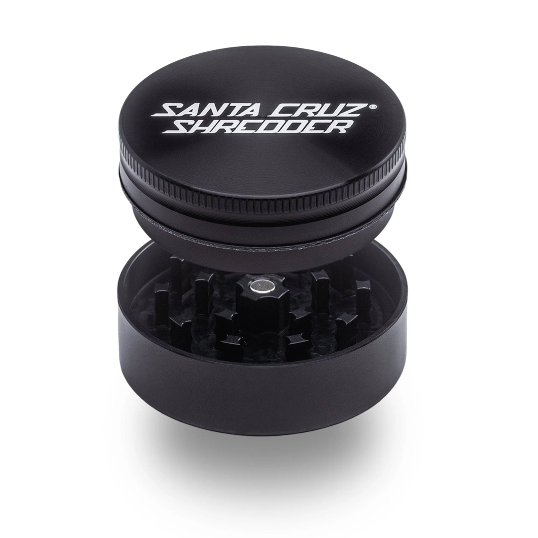 Black Santa Cruz Shredder 2-Piece Medium Grinder – magnetic lid open showing sharp teeth and matte finish.