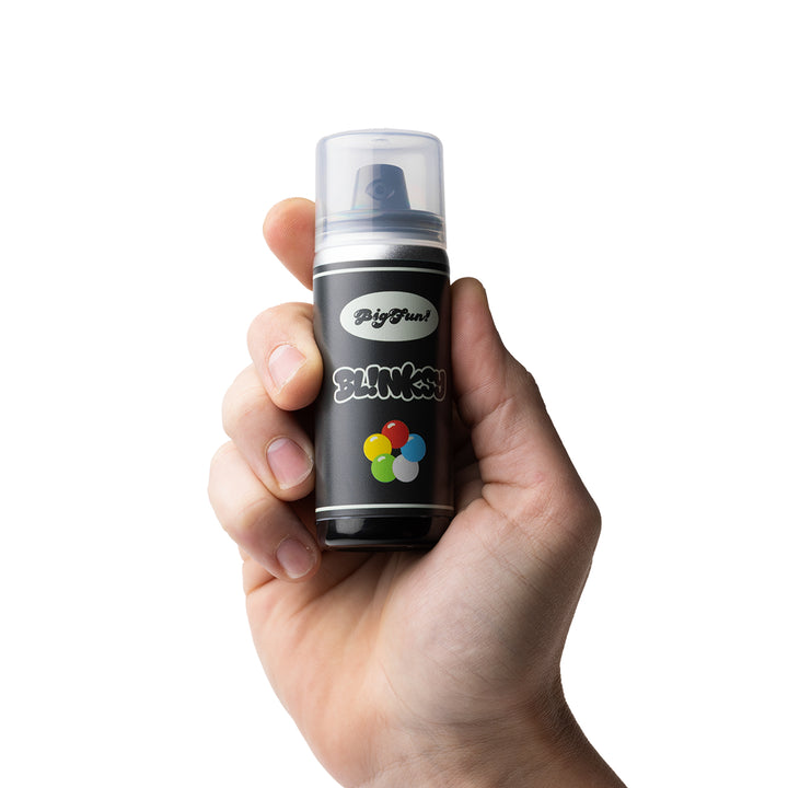 BigFun! Blinksy held in a hand with the cap on, showing the size of the concealed spray-can vape