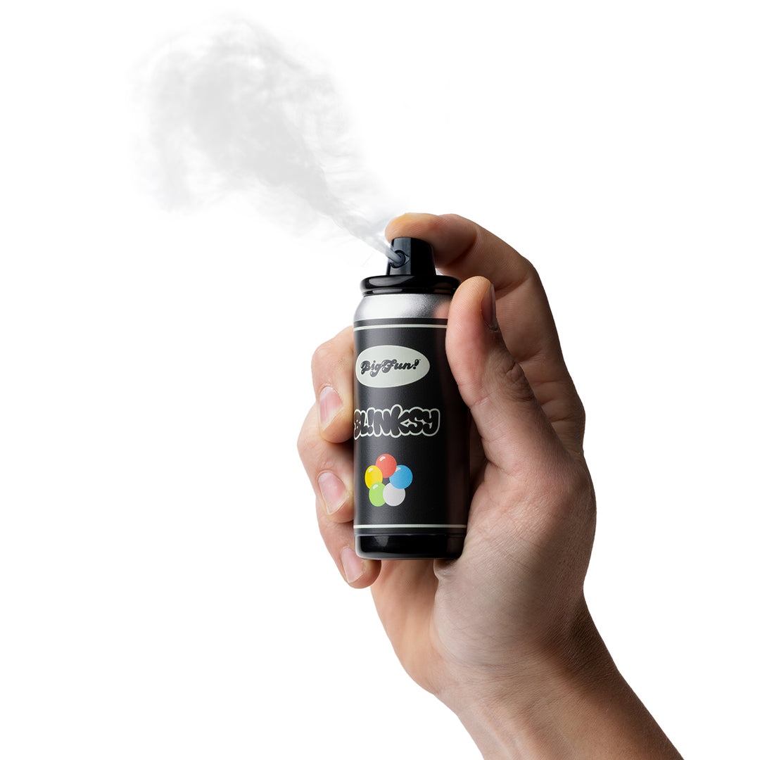 BigFun! Blinksy in hand with Spray Mode active, fan pushing vapor out of the nozzle like a paint burst
