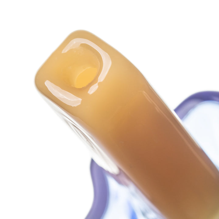 Close-up of the BigFun! Pipesicle mouthpiece at the stick end of the glass popsicle, showing the borosilicate opening