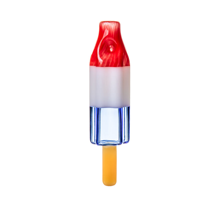 BigFun! Pipesicle Red White Blue hand pipe standing vertically, a 6-inch handcrafted borosilicate glass rocket popsicle in red, white, and blue with a glass stick at the base