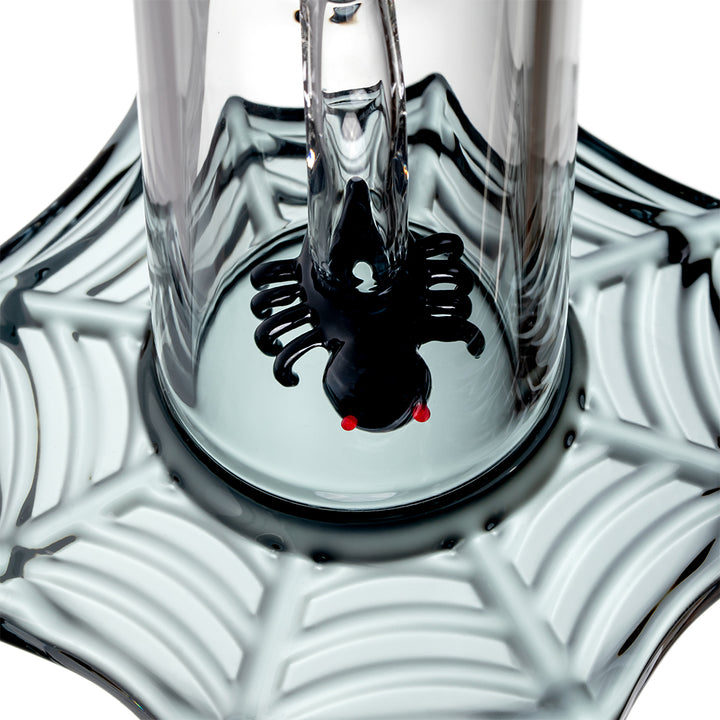 Close-up detail of MJ Arsenal Widowmaker Bong spider percolator inside web-themed base
