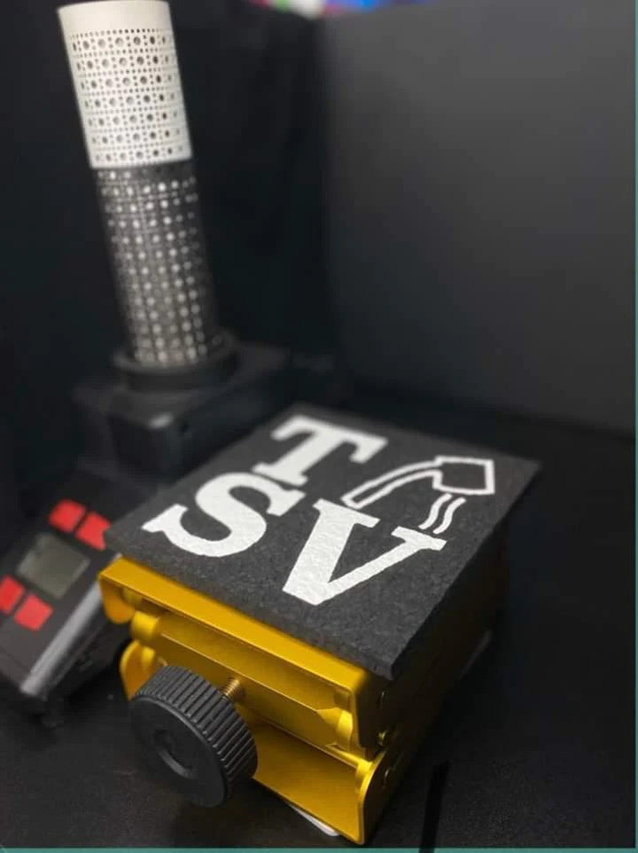 Close-up of Terp Sous Vide Complete Kit showing digital torch and TSV-branded mat on gold lift for precision dabbing setup.