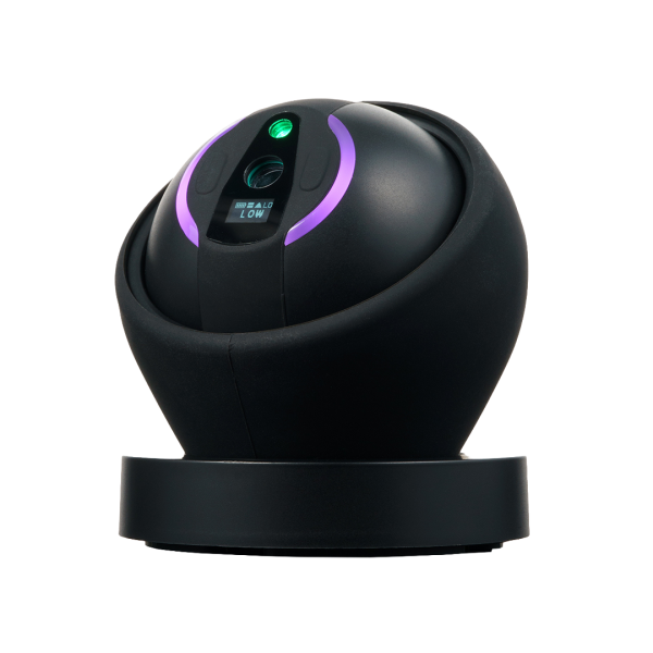 Dab Rite Go seated on its magnetic charging dock — showing the arm-free countertop form factor
