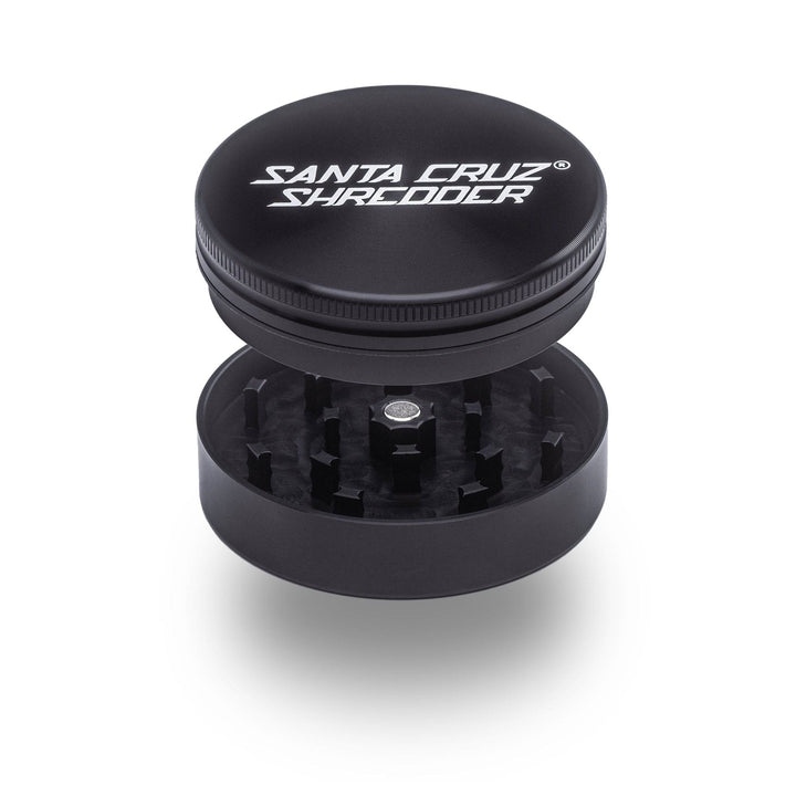 Black Santa Cruz Shredder 2-Piece Large Grinder – open view showing razor-sharp teeth and lid fit.