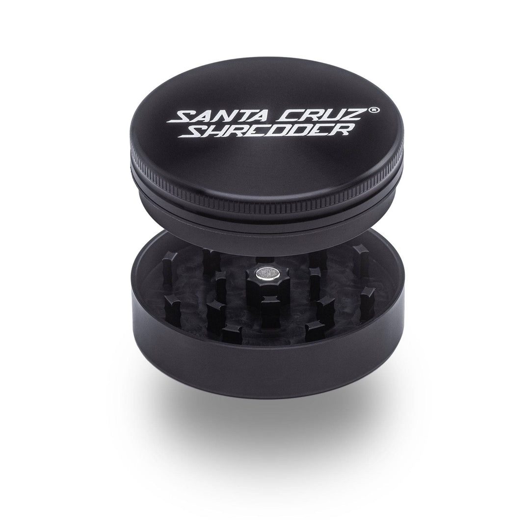 Black Santa Cruz Shredder 2-Piece Large Grinder – open view showing razor-sharp teeth and lid fit.