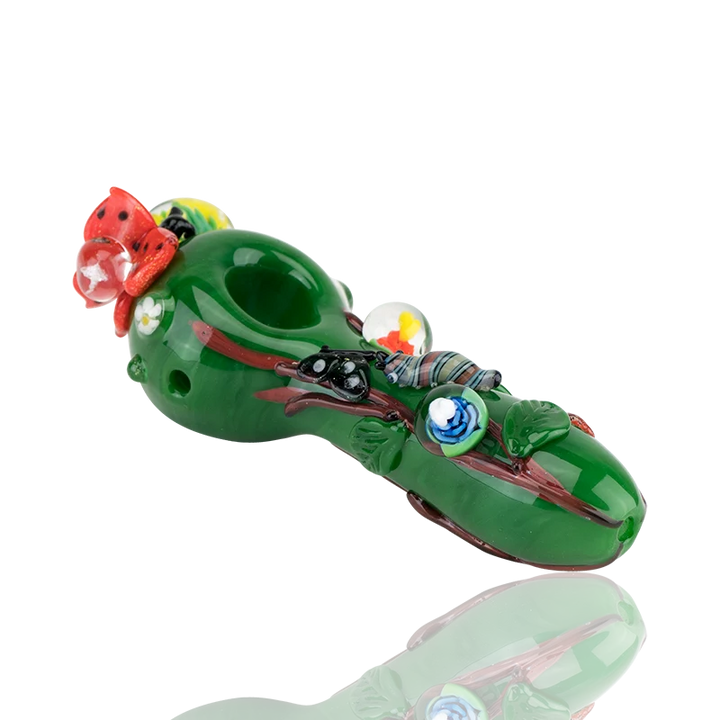 Empire Glassworks Garden Critters Small Spoon Pipe, 4.5" deep green borosilicate with flower implosion marbles, white daisies and a sculpted red ladybug