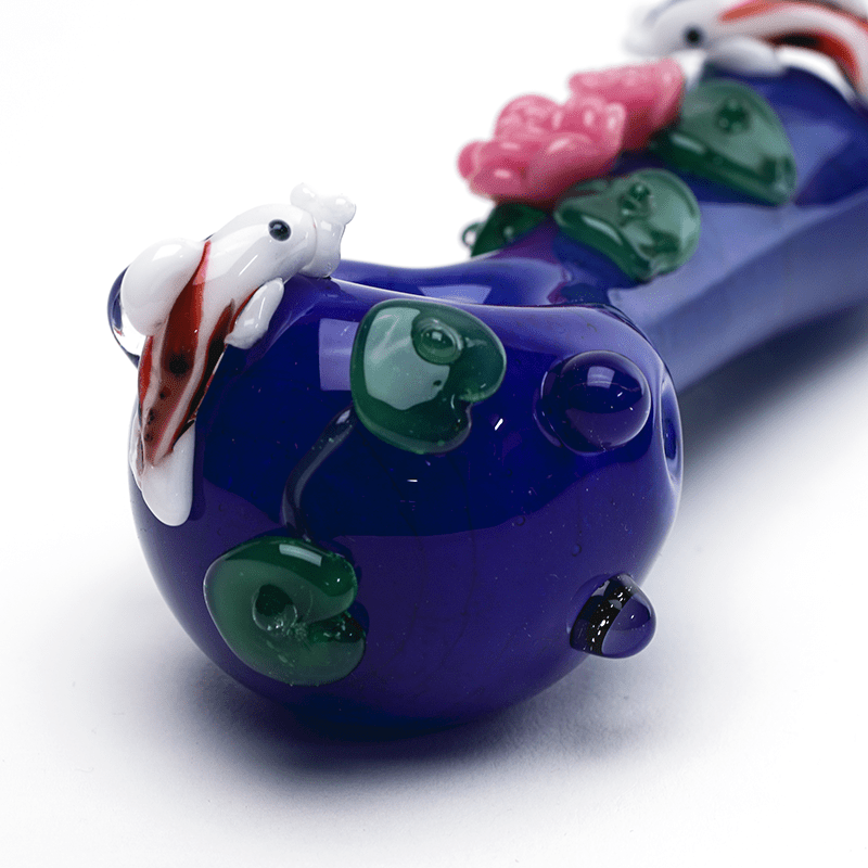 Empire Glassworks Koi Pond Pipe Small bowl close-up – koi curling over the rim, notched green lily pads and raised blue dots