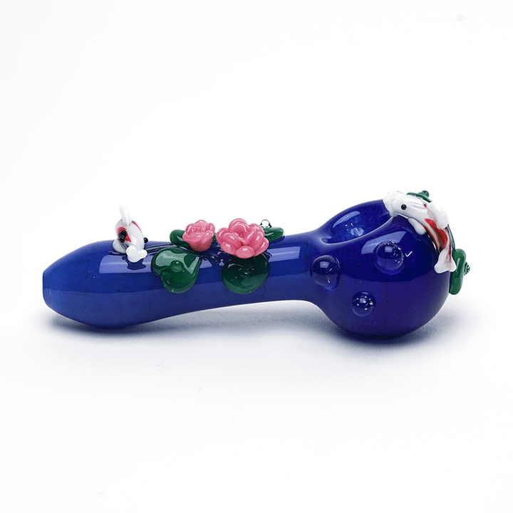 Empire Glassworks Koi Pond Pipe Small side view – 4.5-inch cobalt blue spoon with koi at both ends and lotus flowers mid-stem