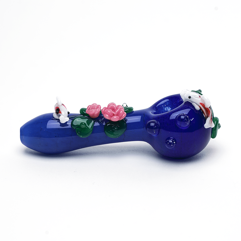 Empire Glassworks Koi Pond Pipe Small side view – 4.5-inch cobalt blue spoon with koi at both ends and lotus flowers mid-stem
