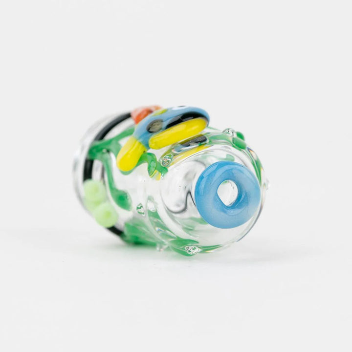 Empire Glassworks Under the Sea Pivot Top – laying angle showing glass mouthpiece opening and ocean accents.