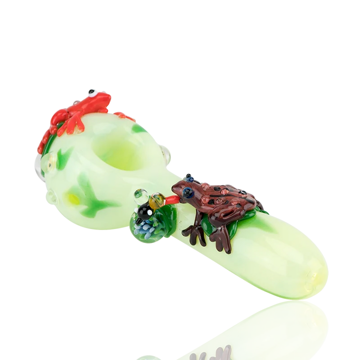 Empire Glassworks Ribbit Small Spoon Pipe, 4.5" pale lime borosilicate with a red toad and a dark brown toad on green lilypads, an implosion marble and a sculpted insect