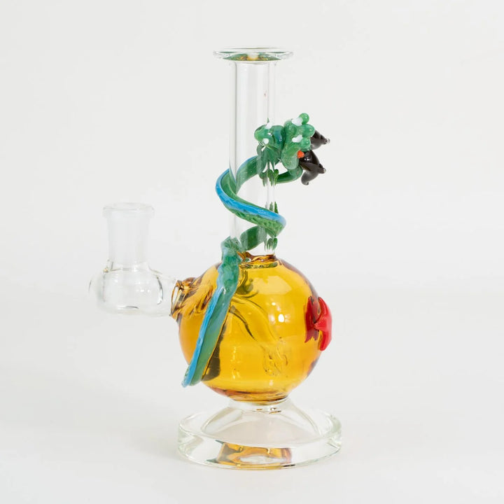 Empire Glassworks Dragon Sphere Mini Rig side view – dragon tail wrapping the amber sphere, 14mm female joint and flat clear foot