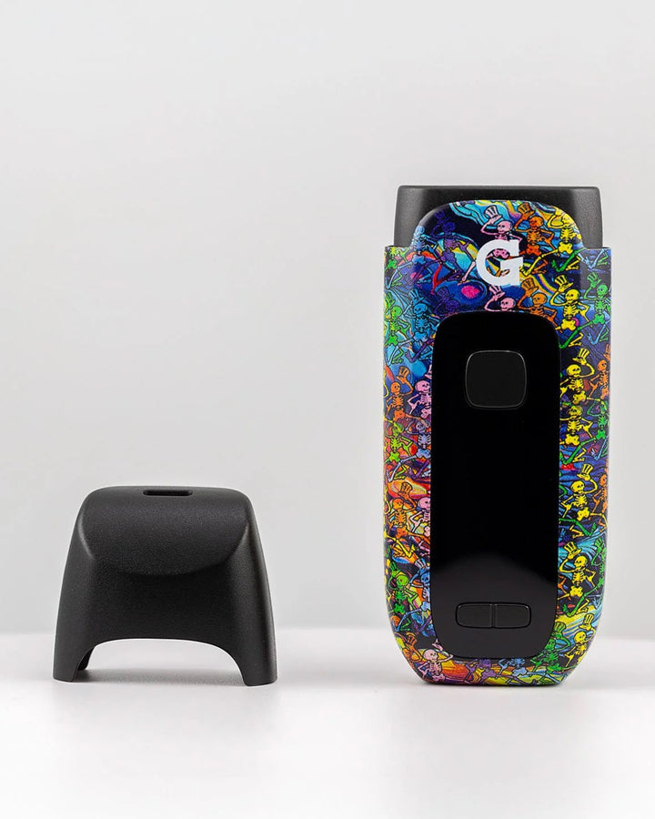 G Pen Dash+ Grateful Dead – Mouthpiece removed from vaporizer featuring tie-dye artwork and vent detail.