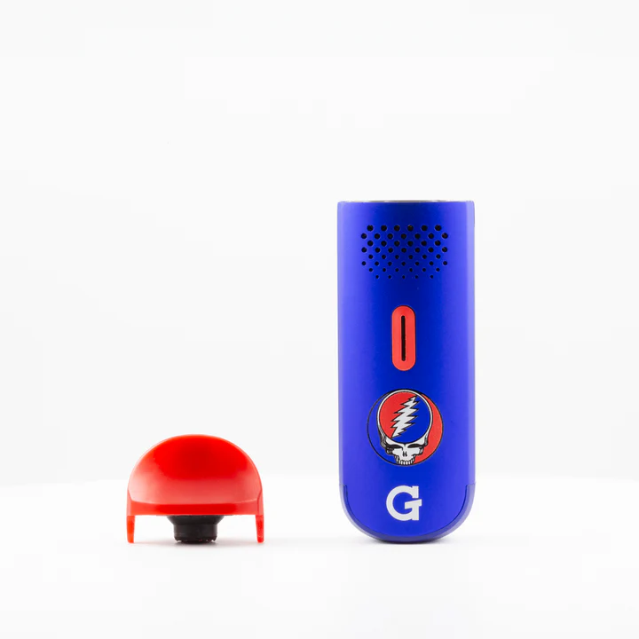 G Pen Dash Grateful Dead – standing upright with red mouthpiece removed to reveal stainless herb chamber.