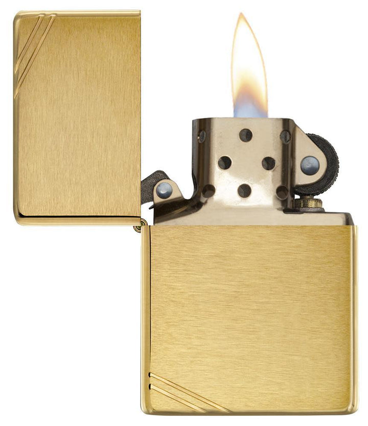Zippo Brass Vintage lighter with brushed brass finish and slashes, windproof flame design, ideal for collectors and everyday use.