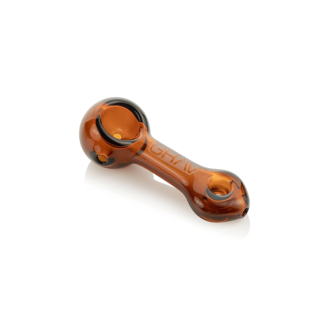 GRAV Mini Spoon in amber glass with ash-catching donut mouthpiece, side view.