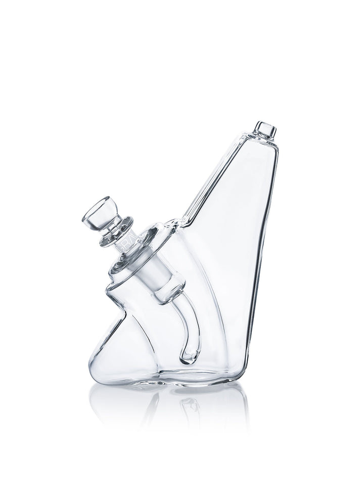 GRAV Wedge Bubbler in clear, left side — showing the rounded corners and low wide wedge profile designed to be held.