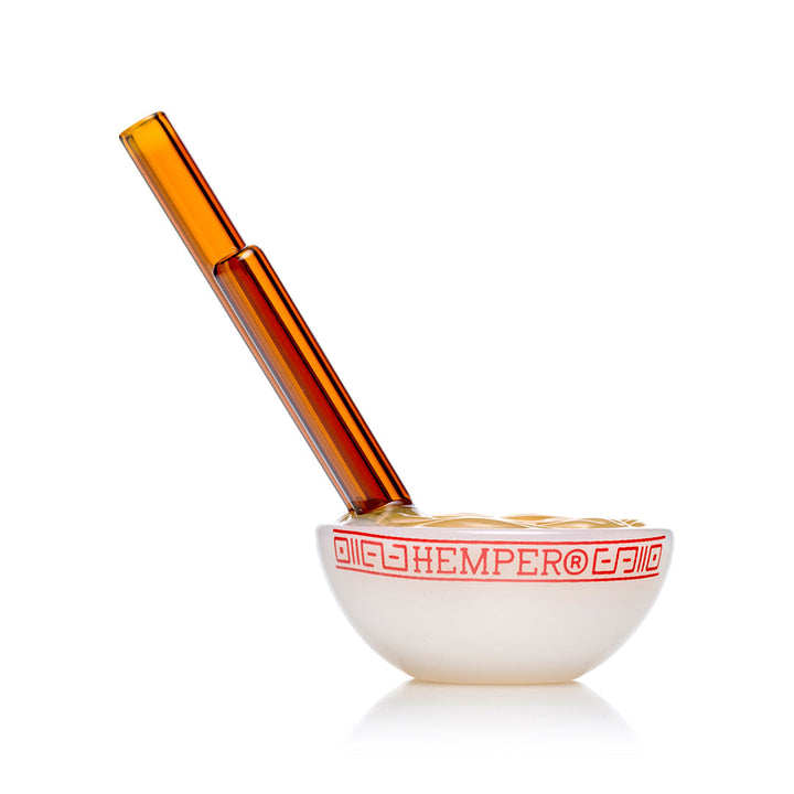 Hemper Ramen Bowl hand pipe at an angle with the amber chopstick mouthpieces tilted