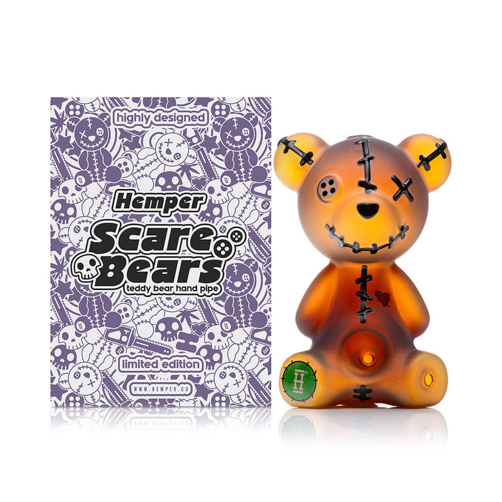 Hemper Scare Bears Teddy Bear hand pipe beside its limited edition retail packaging