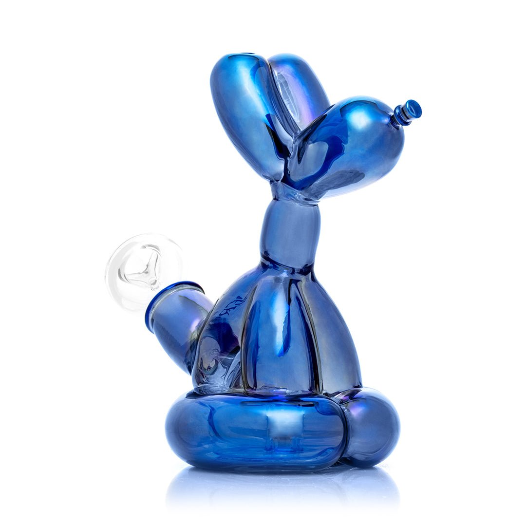 Hemper Sitting Balloon Dog Bong angled front view, showing how the iridescent finish shifts colour in the light
