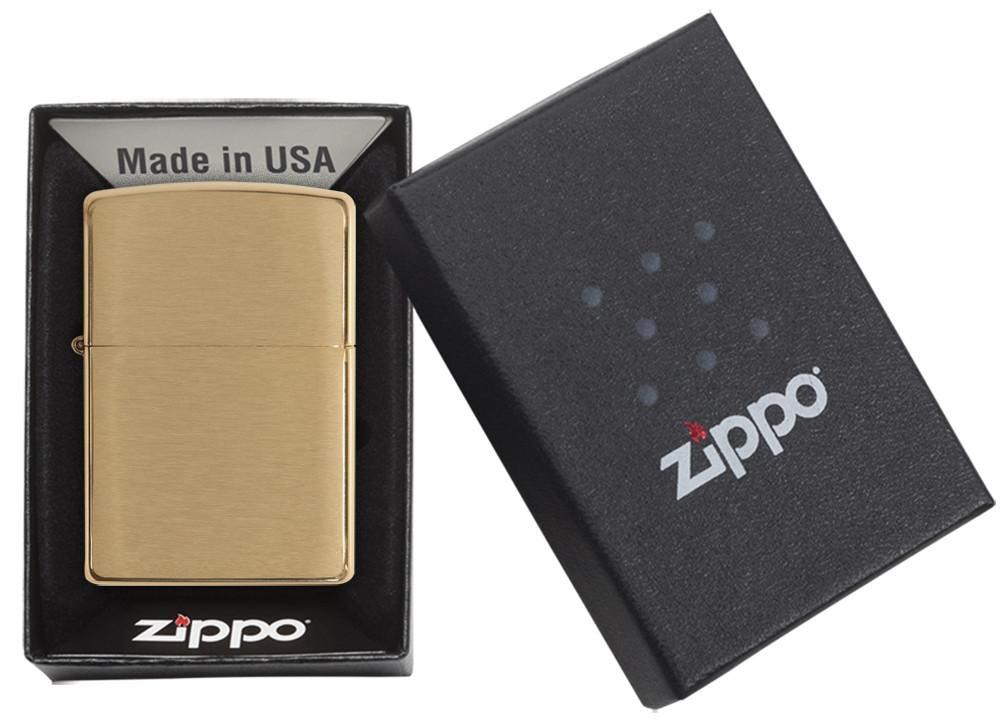 Zippo Brushed Brass Lighter in original black gift box with Zippo logo. Windproof, refillable, and made in the USA with a lifetime guarantee.