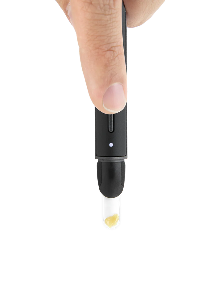 Puffco Hot Knife in use releasing concentrate from heated ceramic tip for clean loading