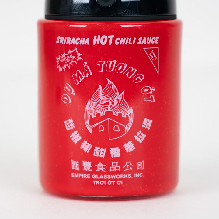Empire Glassworks Sriracha Sauce Puffco Proxy Core Attachment, close-up of the hot sauce label detail.