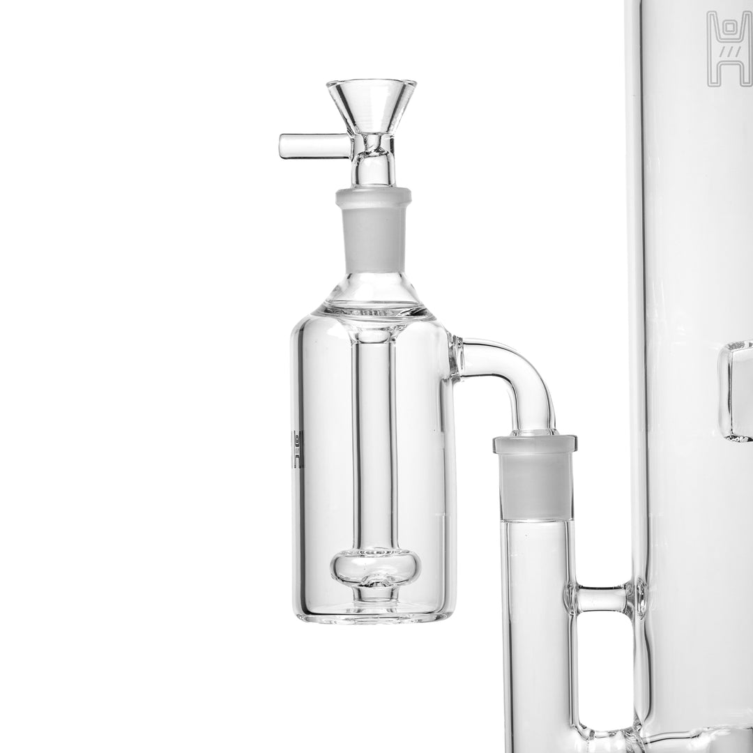 Human Grade Standard 14mm Ash Catcher fitted to a bong, showing the male joint seated in the water pipe and a bowl in the ash catcher&