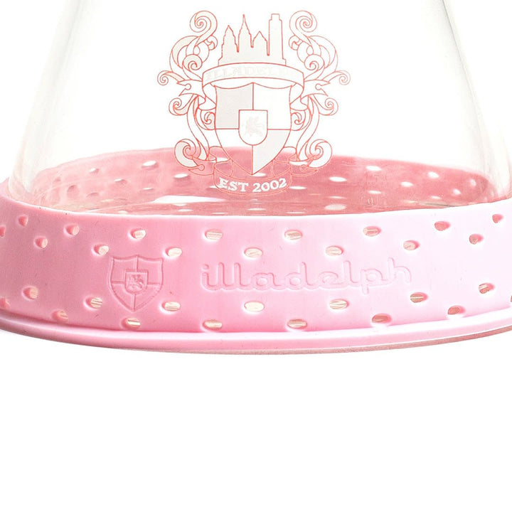pink illadelph silicone base bumper fitted onto an illadelph mini beaker showcasing improved shock absorption and secure tabletop placement