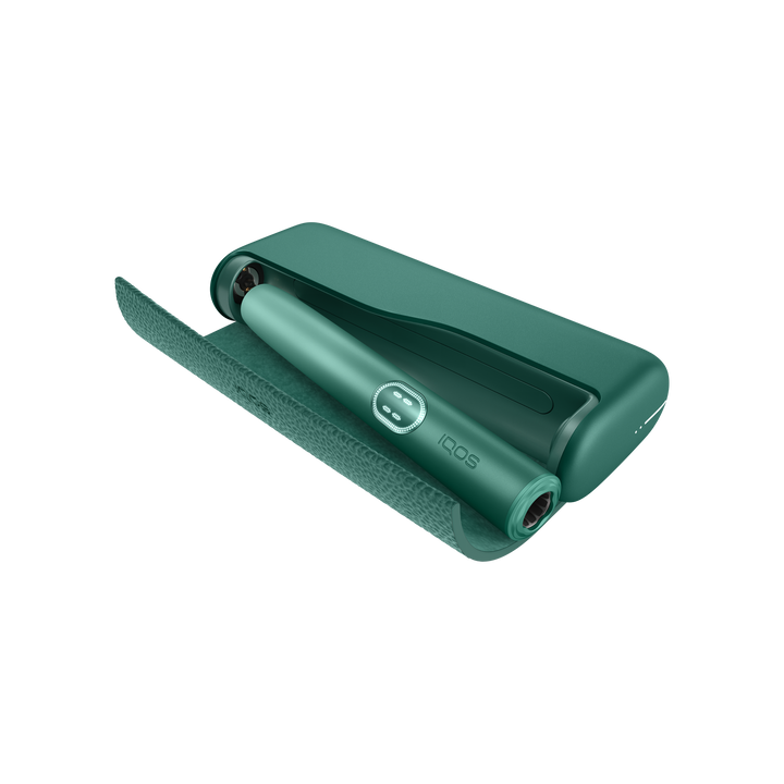 IQOS ILUMA i PRIME Aspen Green pocket charger with the wraparound cover open and the holder docked inside