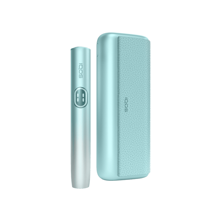 IQOS ILUMA i PRIME Breeze Blue holder standing beside the closed pocket charger, front view