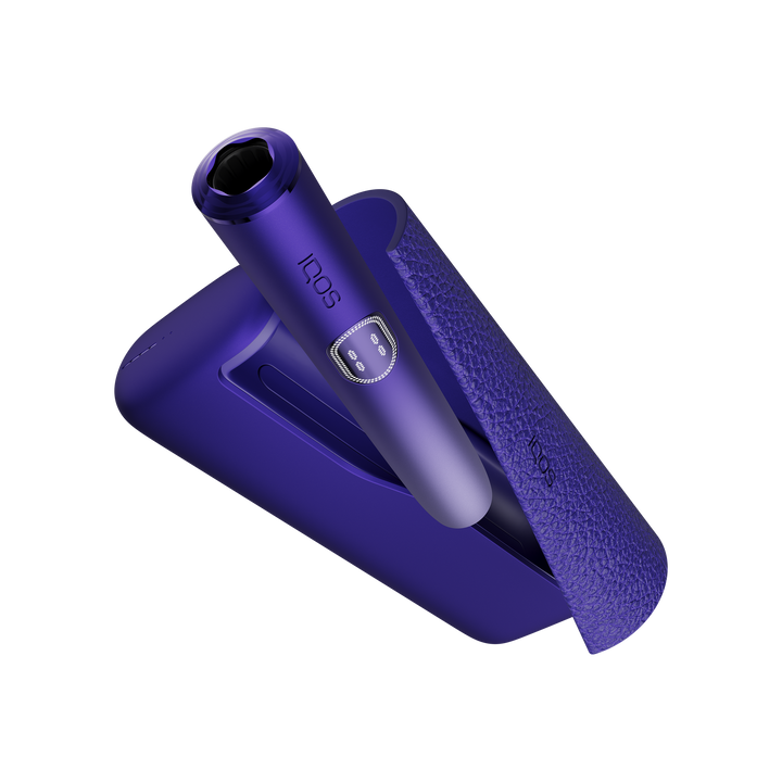 IQOS ILUMA i PRIME Electric Purple holder being docked into the open pocket charger