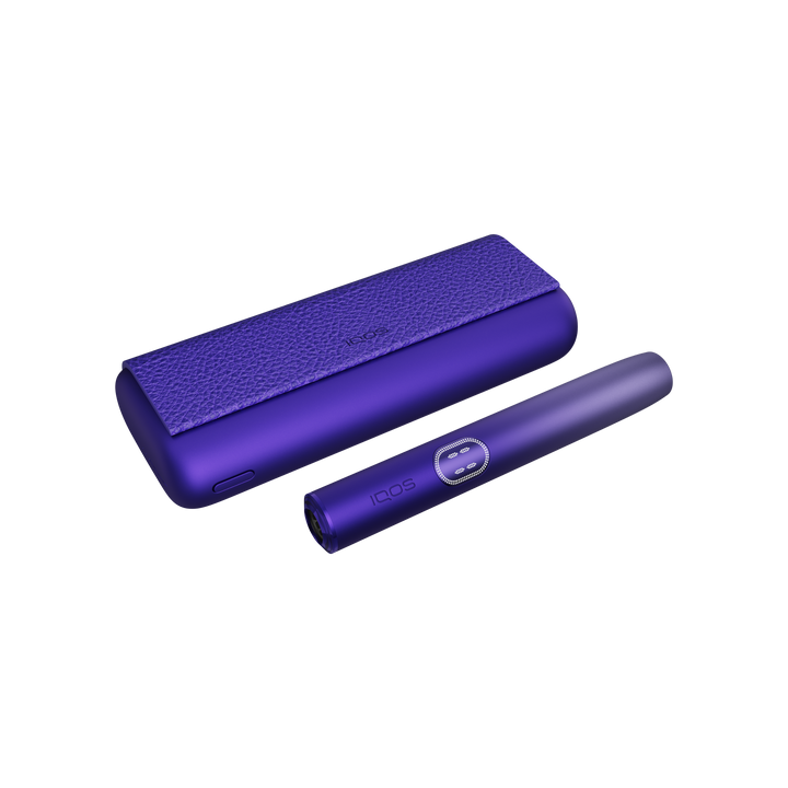 IQOS ILUMA i PRIME Electric Purple closed pocket charger lying flat with the holder beside it