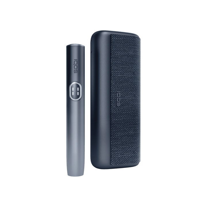 IQOS ILUMA i PRIME Midnight Black holder standing beside the closed pocket charger, front view