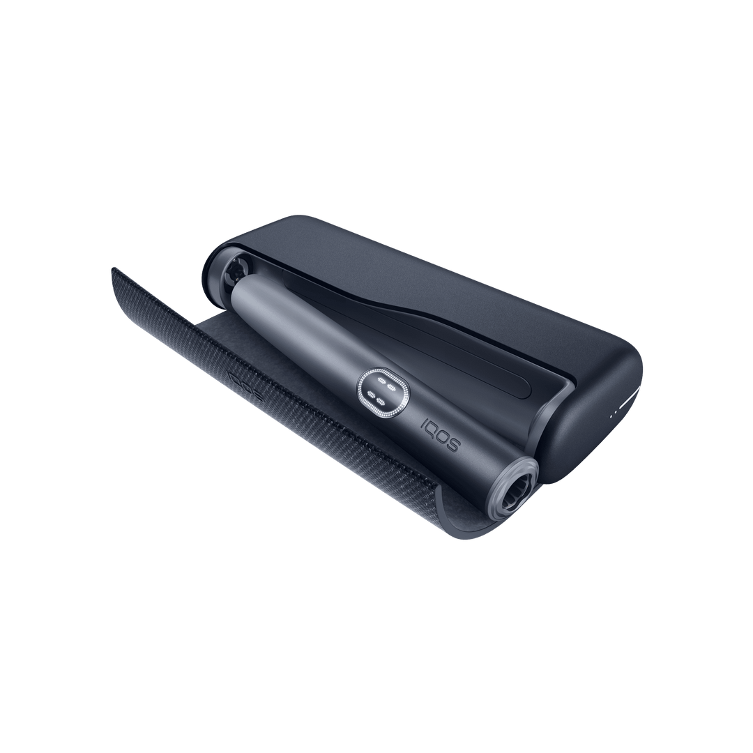 IQOS ILUMA i PRIME Midnight Black pocket charger with the wraparound cover open and the holder docked inside