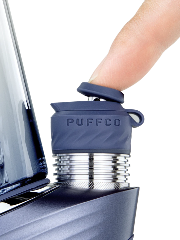 Puffco Peak Pro Storm 3DXL – hand interacting with joystick cap, showing grip and control placement.