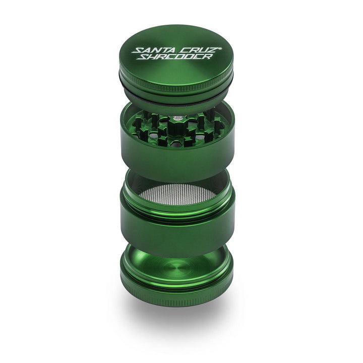 Green Santa Cruz Shredder 4-Piece Medium Aluminum Grinder with smooth threading and screen.