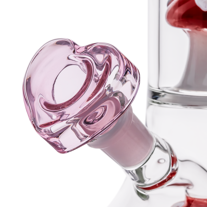 Close-up of MJ Arsenal - Lovecap Water Pipe showing the pink heart-shaped glass bowl attachment, crafted for a romantic aesthetic.