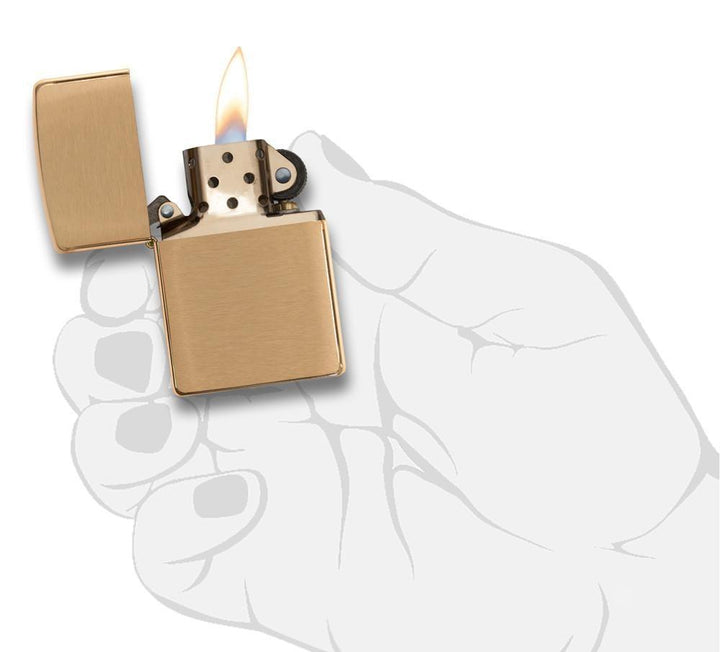 Zippo Brushed Brass Lighter with windproof flame, shown open in a hand illustration. Classic refillable design with lifetime guarantee.