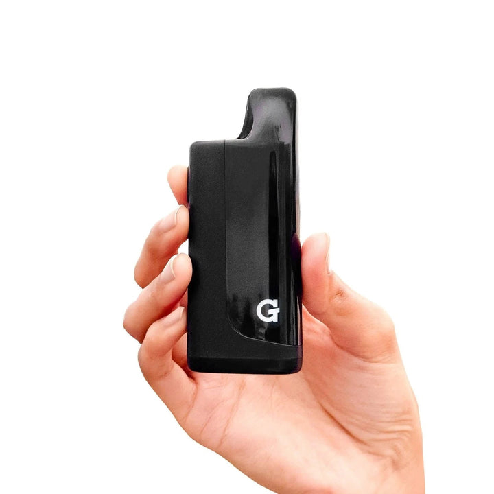 G Pen Hydout 510 Cartridge Battery – held in hand showing portable pocket-size design.