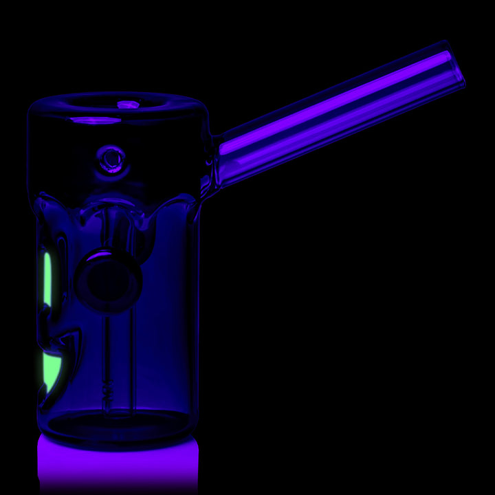 MJ Arsenal Frankenbubbler under black light, side profile with the face glowing at the edge